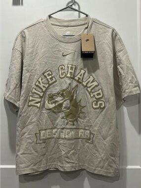 Nike Beige 'Nike Champs' Graphic Short Sleeve Tee